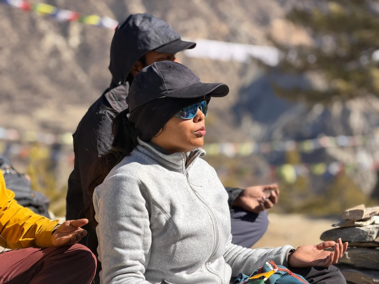 Practitioners in a communal yoga class — movement and stillness together