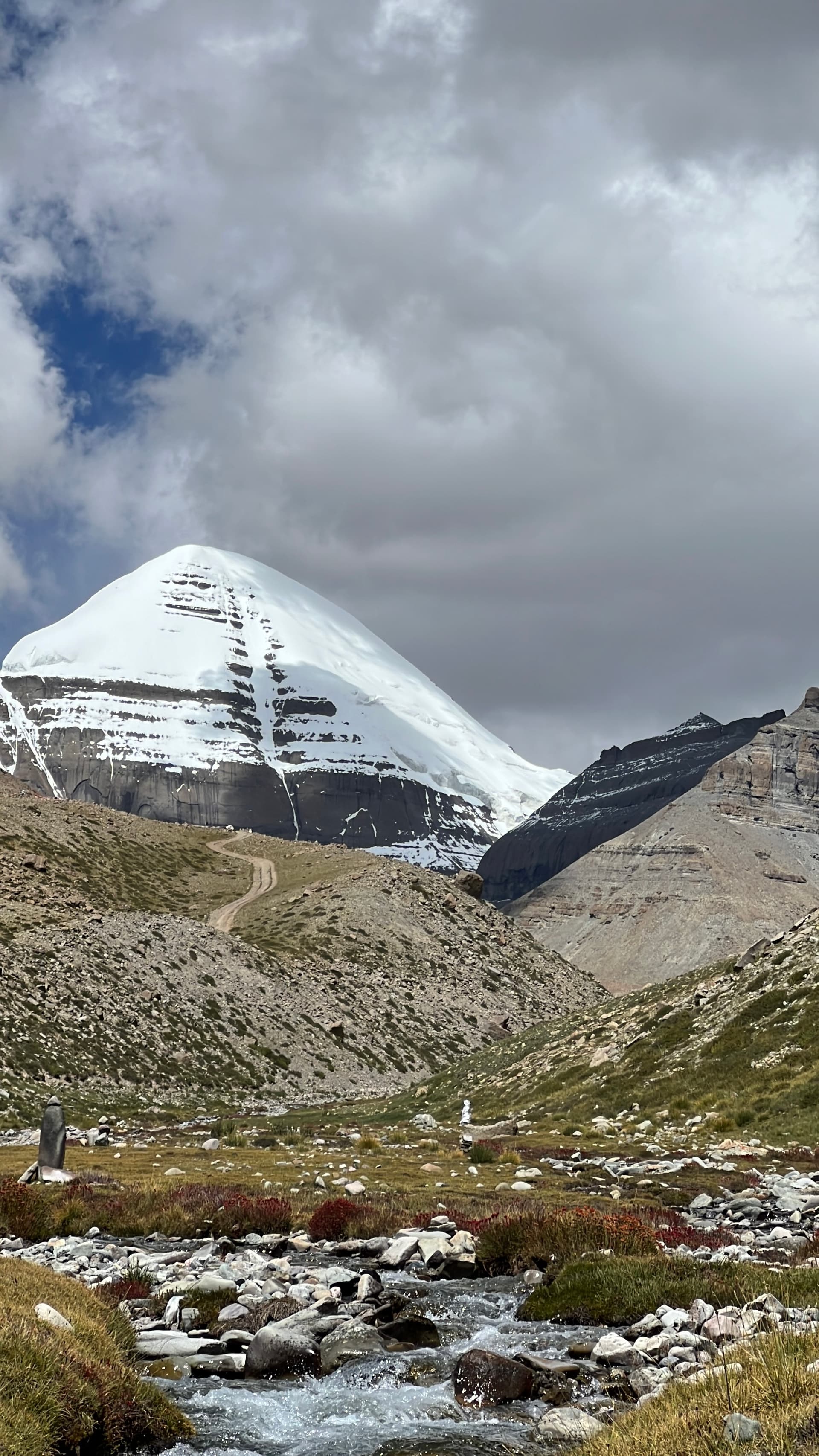 Mount Kailash south face from Ashtapad with Nandi Parvat and a mountain stream in the valley below