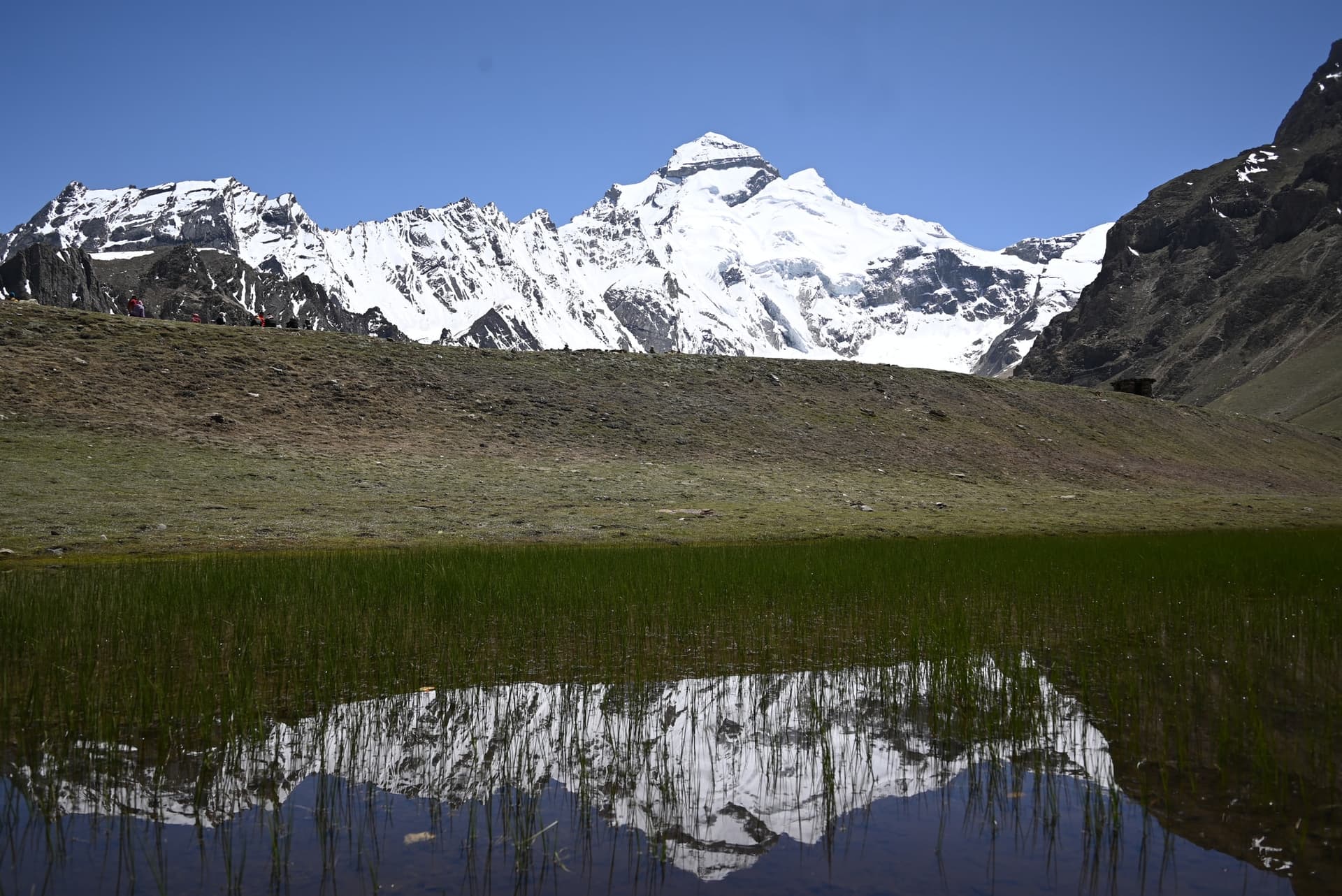 Wide view of snow-capped Adi Kailash rising above the Himalayan valley