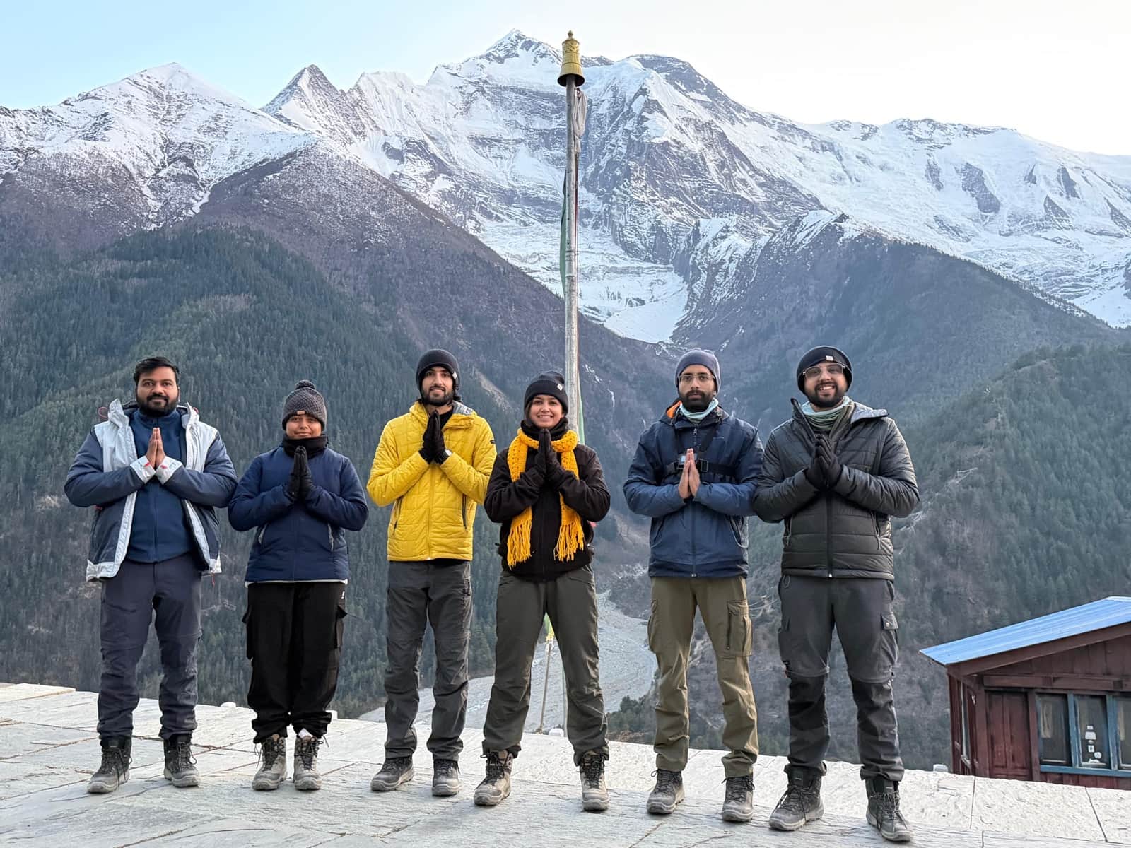 Seekers in prayer pose overlooking the Annapurna massif