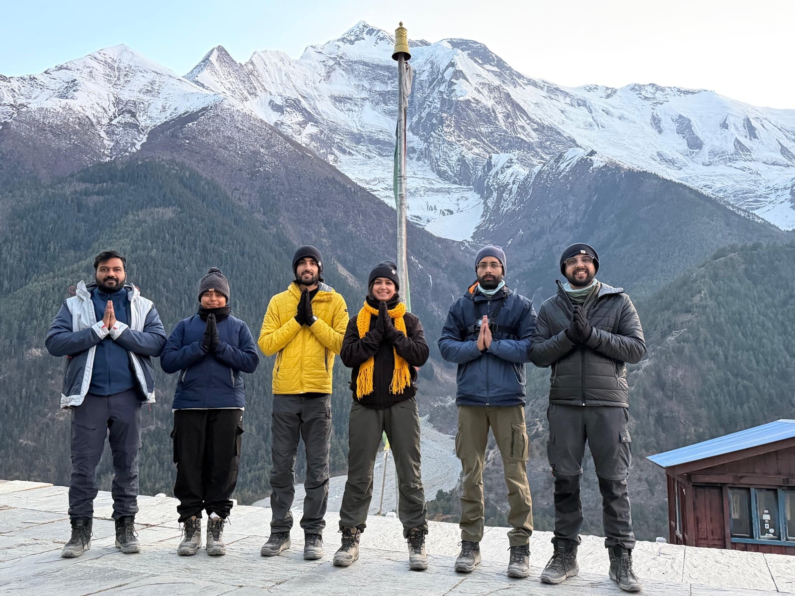 Seekers in prayer pose overlooking the Annapurna massif